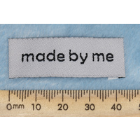 Tag, white, black embroidered wording "made by me" 