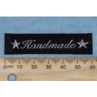 Tag,black, silver embroidered wording "Handmade " with 2 star symbols
