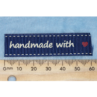 Tag,blue with white print wording "handmade with " with red heart symbol