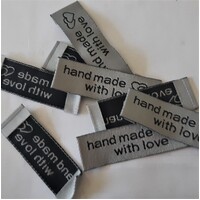 Tag, silver, black embroidered wording "hand made with love " with double heart symbol