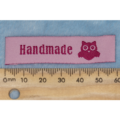 Tag, pink, hot pink embroidered wording "Handmade" with Owl symbol