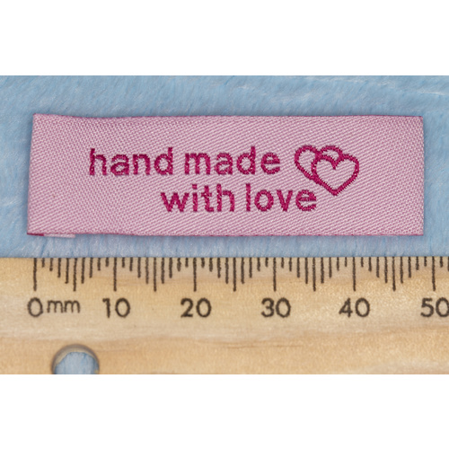 Tag, pink, hot pink embroidered wording "hand made with love" with double heart symbol