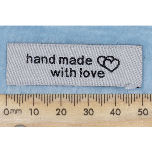 Tag,white, black embroidered wording "hand made with love " with double heart symbol